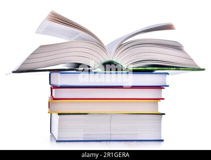 Composizione con pila di libri isolato su bianco Foto Stock