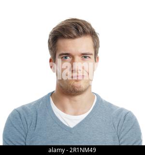 un giovane dispiaciuto o scettico sta facendo un volto Foto Stock