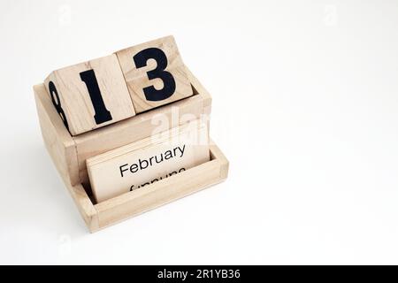 Calendario perpetuo in legno che mostra il 13th febbraio Foto Stock