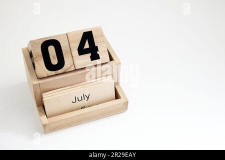 Calendario perpetuo in legno che mostra il 4th luglio Foto Stock