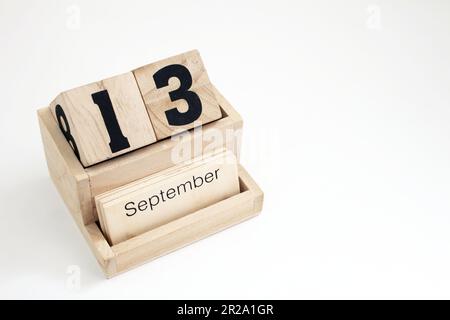 Calendario perpetuo in legno che mostra il 13th settembre Foto Stock