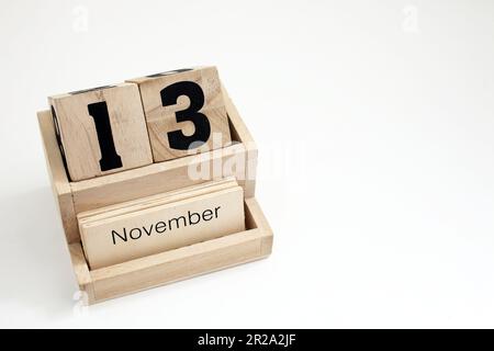 Calendario perpetuo di legno che mostra il 13th novembre Foto Stock