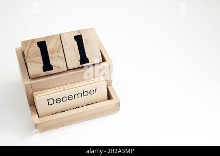 Calendario perpetuo in legno che mostra il 11th dicembre Foto Stock