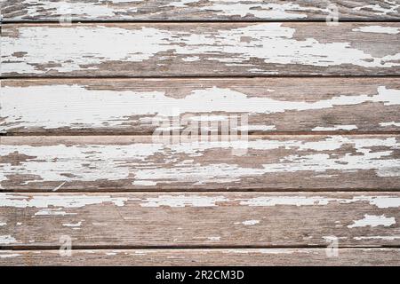 Fondo in legno, vecchie tavole dipinte, con vecchia vernice bianca. Idea per sfondo o screensaver Foto Stock
