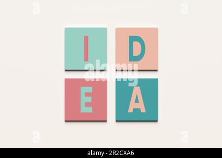 Creazione di idee creative, brainstorming e concetto di soluzione aziendale. Lavoro di squadra e idea. La parola idea su blocchi quadrati colorati. Foto Stock