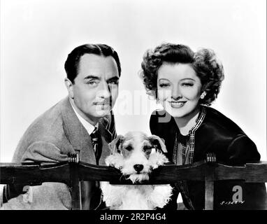 WILLIAM POWELL come Nick Charles MYRNA LOY come Nora Charles e asta The Dog Portrait in THE THIN MAN GOES HOME 1944 regista RICHARD THORPE basato su personaggi creati da Dashiell Hammett storia originale Robert Riskin e Harry Kurnitz sceneggiatura Robert Riskin e Dwight Taylor Metro Goldwyn Mayer (MGM) Foto Stock