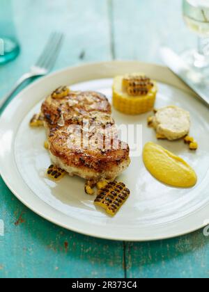 Arrosto di rana pescatrice con macis, granturco dolce e burro salato Foto Stock