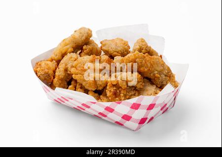 Goujons di pesce in un vassoio di cartone Foto Stock