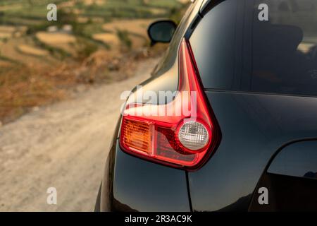 Closeup della luce di stop crossover Nissan Juke Foto Stock