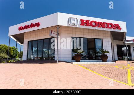 Parte esterna dell'ingresso della concessionaria del veicolo Honda Foto Stock