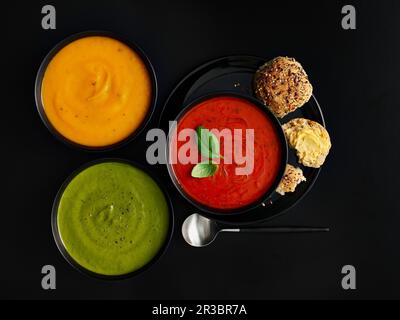 Tre diverse zuppe di crema colorate Foto Stock