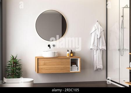 Bagno interno con parquet scuro, wc, doccia e specchio ovale, pareti bianche e nere vista frontale. Bagno nero minimalista con mobili moderni Foto Stock