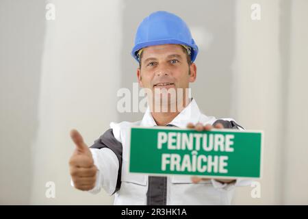 pittore che dà il segno a-ok Foto Stock