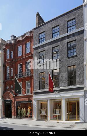 Etro (a sinistra) e Cartier (a destra), negozi di design nella Old Bond Street di Londra, nel cuore del ricco quartiere Mayfair. Foto Stock