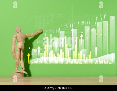 Manichino di legno e grafico con crescente. indicatori su sfondo verde. Analisi degli indicatori finanziari nelle imprese Foto Stock