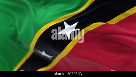 Vista ravvicinata della bandiera nazionale di Saint Kitts e Nevis che sventola nel vento Foto Stock