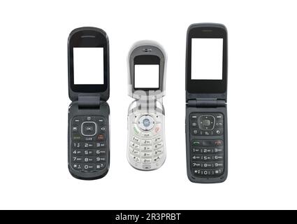 Tre vecchi telefoni cellulari a scatto isolati con schermi tagliati. Foto Stock