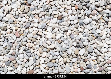 Piccola struttura di fondo in ghiaia di pietra. roccioso, ciottoli di pietra. Foto Stock