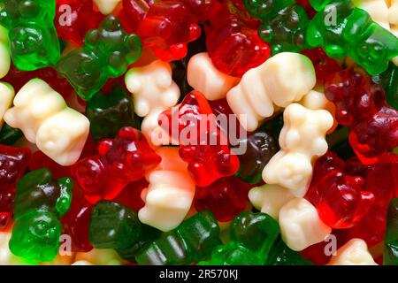 Rosso Bianco e verde Orso Gummy sfondo pile. Foto Stock