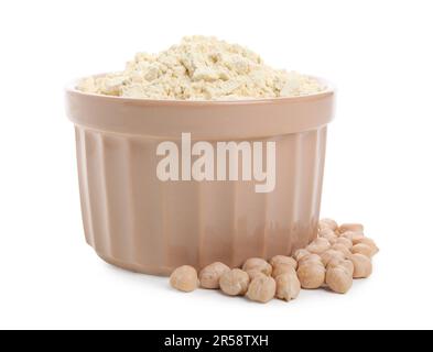 Farina di ceci in ciotola e semi isolati su bianco Foto Stock