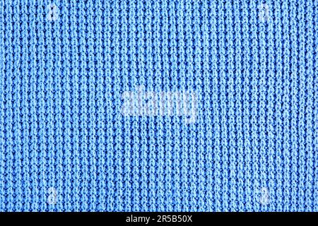 Frammento di abiti a maglia blu di maglia ruvida. Sfondo per il design, il layout Foto Stock