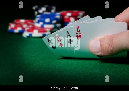 Stack of chips and four aces Stock Photo