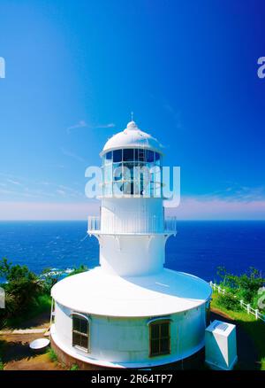 Faro di Capo Murato e barca Foto Stock