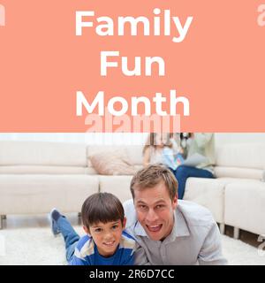 Composto di testo del mese di divertimento per tutta la famiglia e felice padre e figlio caucasico sdraiati sul tappeto a casa Foto Stock