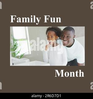 Composto da testo del mese di divertimento per tutta la famiglia e padre afroamericano che guarda la figlia spazzolando i denti Foto Stock