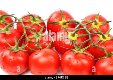 Foto di molto i pomodori freschi presentato su sfondo bianco Foto Stock