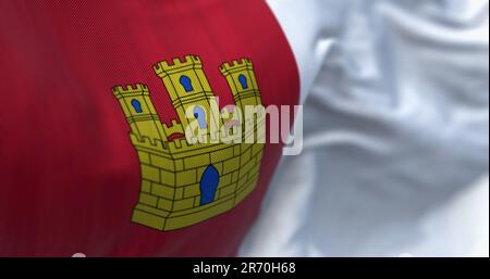 La bandiera di Castilla-la Mancha sventola. Castilla-la Mancha è una comunità autonoma della Spagna. Due piazze: Rosso crimson con un castello d'oro e bianco. 3d illu Foto Stock