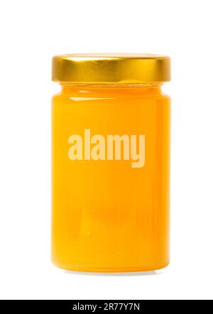 Miele fresco in un vaso di vetro chiuso su uno sfondo bianco isolato primo piano. miele biologico. Prodotti sani. Foto Stock