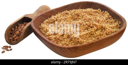 Semi di lino tritati in una ciotola con una paletta di legno Foto Stock