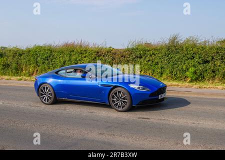 2017 Blue Aston Martin Db11 V12 Auto V12 Touchtronic Auto Start/Stop Car Coupe benzina 5204 cc, alimentato da un nuovissimo motore 5.204cc (5,2 L; 317,6 cu in) bicilindrico V12 chiamato AE3; al Classic & Performance Motor Show a Hoghton Tower; Supercar Showtime Giugno 2023 Foto Stock