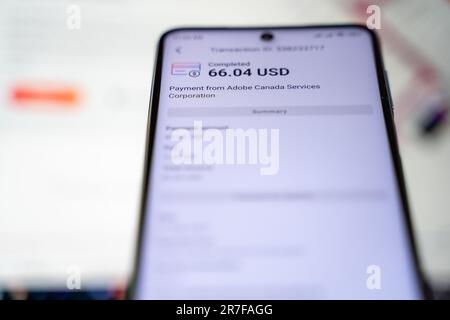 Payoneer e pagamento da Adobe Canada Services Corporation sullo schermo dello smartphone. Ankara, Turchia - 14 giugno 2023. Foto Stock