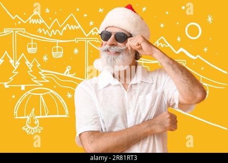 Fresco Babbo Natale su sfondo giallo con stazione sciistica disegnata Foto Stock