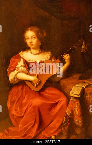 Inghilterra, Londra, Heartford House, The Wallace Collection Museum, dipinto intitolato "Una signora che gioca la chitarra" di Caspar Netscher datato 1669 Foto Stock