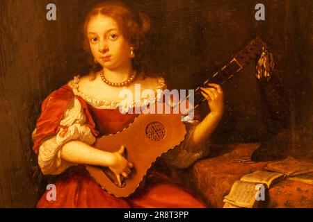 Inghilterra, Londra, Heartford House, The Wallace Collection Museum, dipinto intitolato "Una signora che gioca la chitarra" di Caspar Netscher datato 1669 Foto Stock