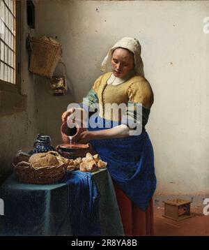 La Milkmaid, c.1660. Una cameriera si concentra molto mentre versa il latte da una brocca. E' una scena tranquilla e tranquilla. L'unico movimento è il flusso di latte. Vermeer ha trasformato una semplice composizione di un soggetto prosaico in un'intensa opera d'arte. È nel rendering della luce che Vermeer ha veramente eccelluto, dipingendo piccoli puntini per i punti salienti, come sul pane e sul panno blu. Foto Stock
