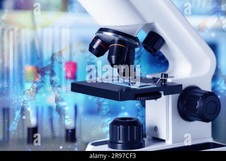 Test genetici. Microscopio e illustrazione della struttura del DNA in laboratorio