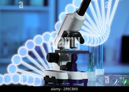 Test genetici. Microscopio e illustrazione della struttura del DNA in laboratorio