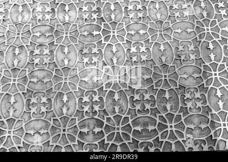 Sfondo frammento di trama da una parete in stucco ricoperta con motivi tradizionali a Segovia, Spagna. Foto Stock