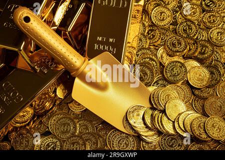 Pala dorata che raccoglie pile di monete d'oro e pile di lingotti d'oro Foto Stock