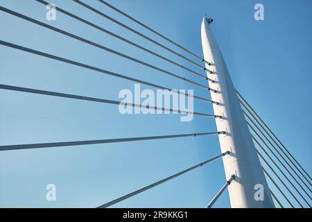 Pylon of cable-stayed bridge opposite low angle view Foto Stock