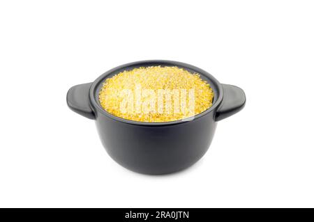 Polenta gialla in un po' di nero piatto in ceramica Foto Stock