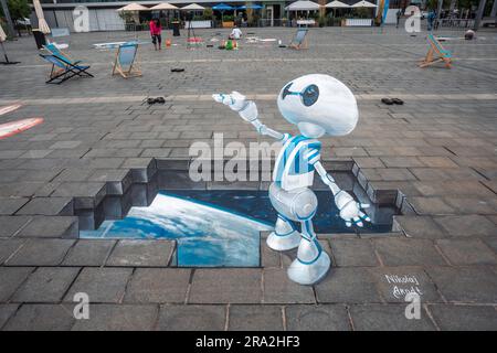 Kaiserslautern, Germania. 30 giugno 2023. Dipinto 3D finito da Nikolaj Arndt. Undici artisti internazionali provenienti da 6 paesi hanno trasformato la pavimentazione Stiftsplatz (piazza) in arte tridimensionale, con "digitalizzazione e Smart City" come argomento di quest'anno. La Street art 3D utilizza la prospettiva per creare illusioni ottiche dello spazio. I visitatori erano invitati a guardare tutti gli artisti al lavoro per tre giorni. Questo è il terzo e ultimo giorno dell'evento. Credito: Gustav Zygmund/Alamy News Foto Stock