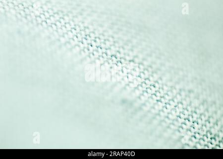 Sfondo testurizzato realizzato con mesh in tessuto raccolto nei dettagli, primo piano e messa a fuoco selettiva. Foto Stock