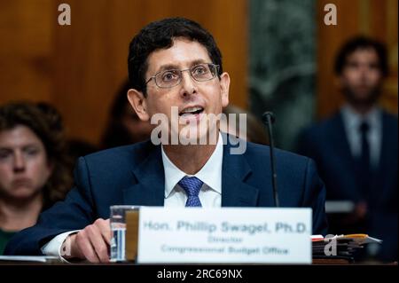 Washington, Stati Uniti. 12 luglio 2023. Phillip Swagel, Direttore, Congressional budget Office, parla ad un'audizione del Senate budget Committee sulla sicurezza sociale al Campidoglio degli Stati Uniti. Credito: SOPA Images Limited/Alamy Live News Foto Stock