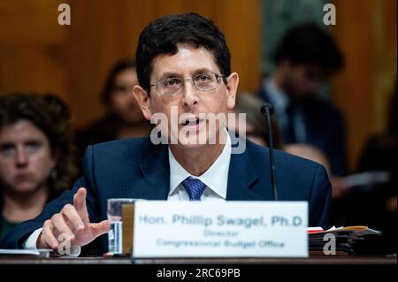 Washington, Stati Uniti. 12 luglio 2023. Phillip Swagel, Direttore, Congressional budget Office, parla ad un'audizione del Senate budget Committee sulla sicurezza sociale al Campidoglio degli Stati Uniti. Credito: SOPA Images Limited/Alamy Live News Foto Stock