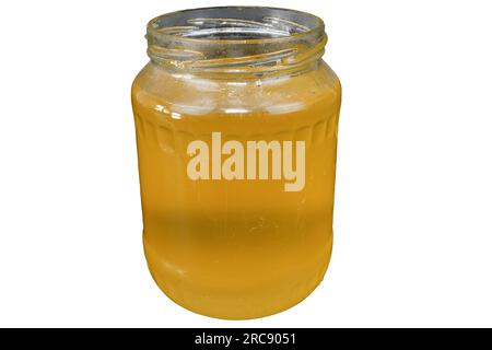 Vaso di vetro con miele. Barattolo di miele. Miele dorato. Miele crudo. Foto Stock